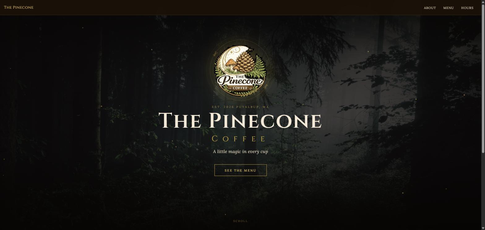 The Pinecone Coffee homepage: a dark, misty forest photograph fills the screen behind a hand-drawn gold-and-cream crest of a crescent moon, pinecone and ferns. An elegant serif wordmark reads 'THE PINECONE COFFEE', with the tagline 'A little magic in every cup' and a slim bordered 'SEE THE MENU' button.
